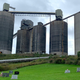 A coal mining facility sits behind headstones in a graveyard in southwest Pennsylvania.